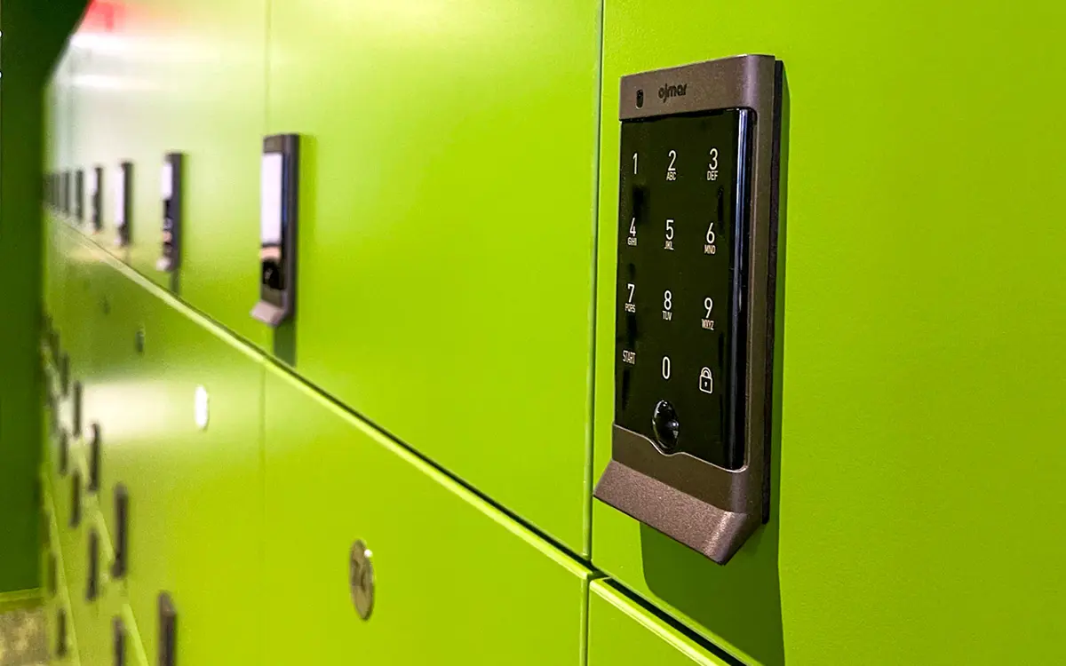 OCS Graphite digital locker locks installed on green lockers